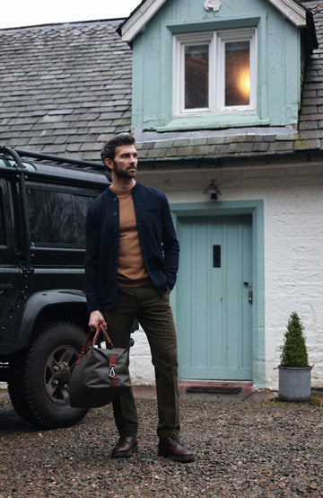 Men's navy wool knitted Nehru jacket by Paul James Knitwear.