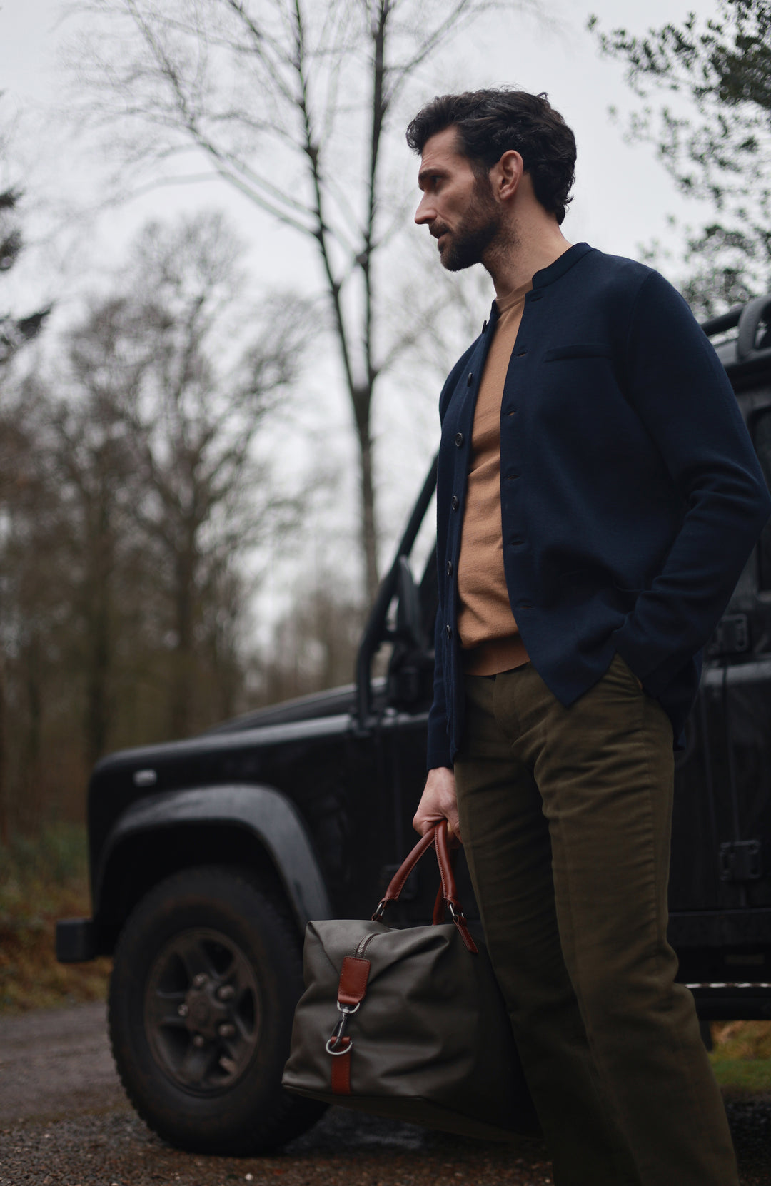 Men's navy wool knitted Nehru jacket by Paul James Knitwear.