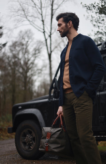 Men's navy wool knitted Nehru jacket by Paul James Knitwear.