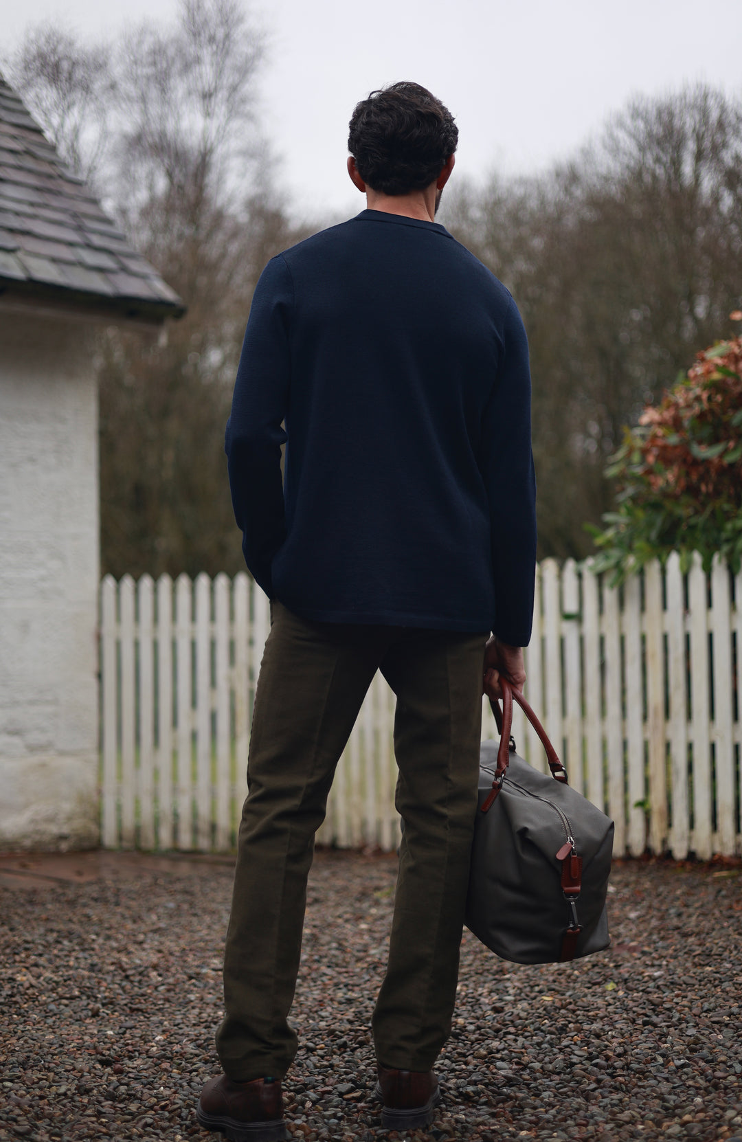 Men's navy wool knitted Nehru jacket by Paul James Knitwear.