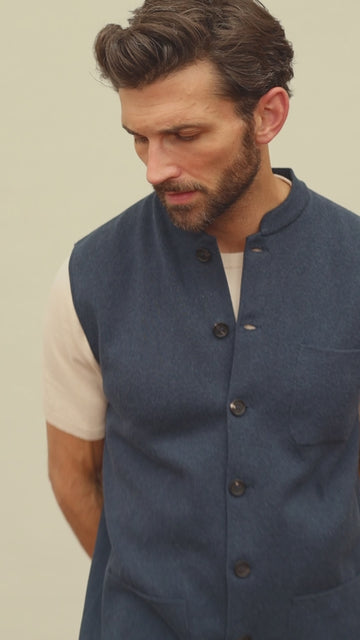 Men's blue sleeveless knitted mandarin jacket by Paul James Knitwear